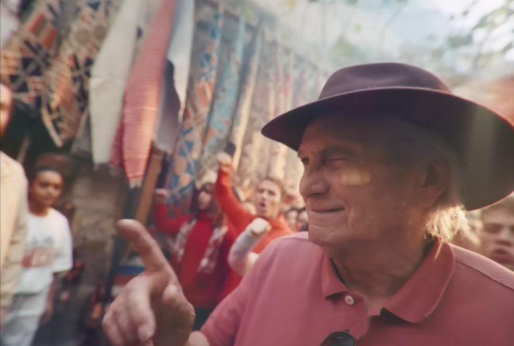 Final film frame — an older fan celebrating in the crowd