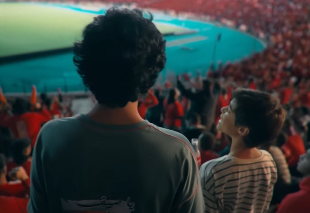 Final film frame — the packed stadium stands