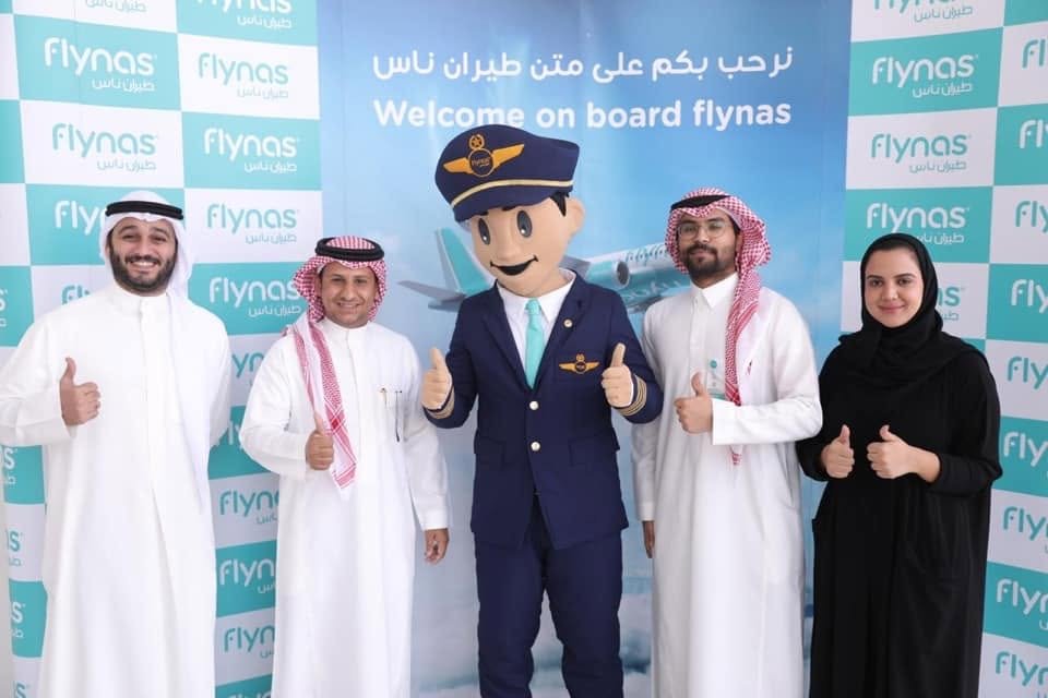 Captain Firnas mascot welcoming guests on board flynas