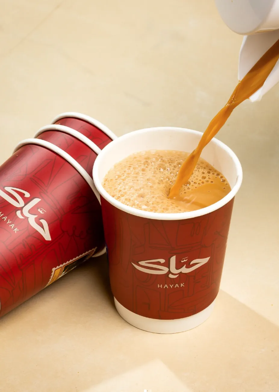 Hot drink poured into a wine-red Hayak cup