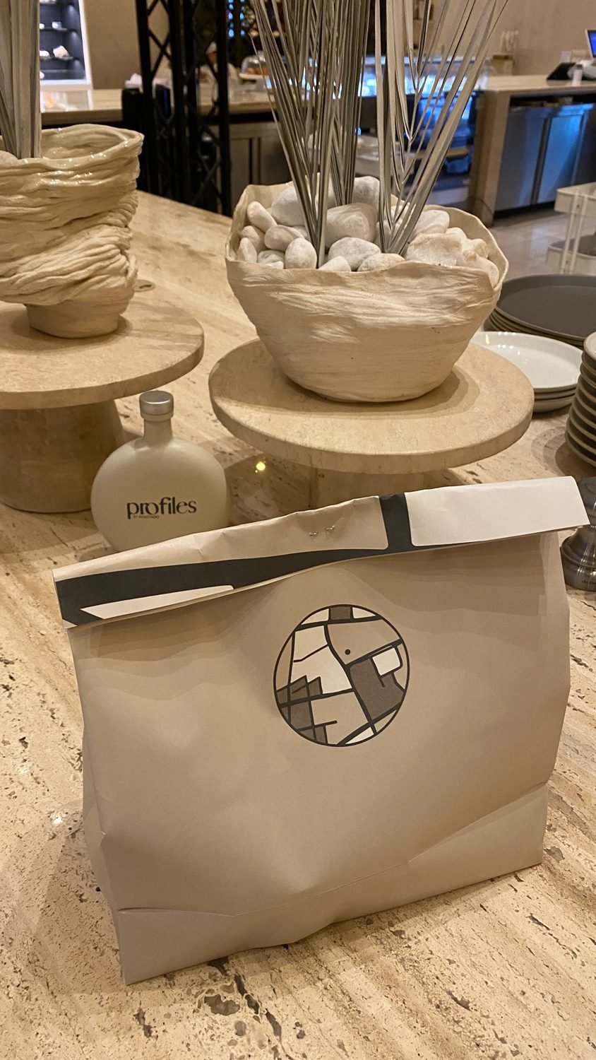 profiles by Roastado paper bags on the counter