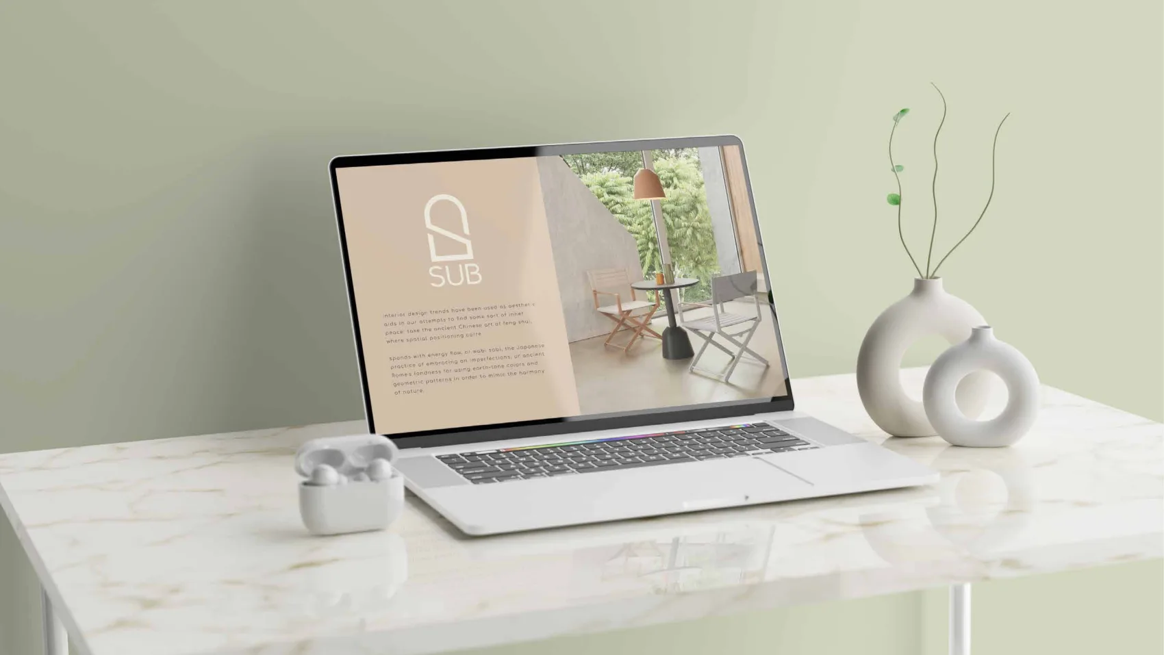 The SUB website on a laptop, showing the mark, an interior photograph and body copy