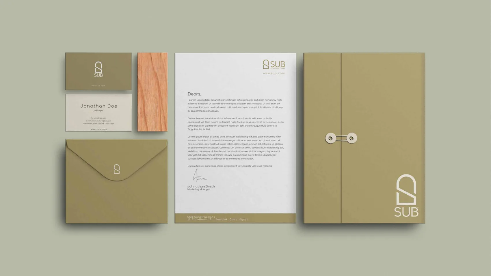 The SUB stationery set — business cards, letterhead, envelope and document folder in olive and cream